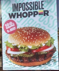 poster outside Burger King highlighting their Impossible Whopper