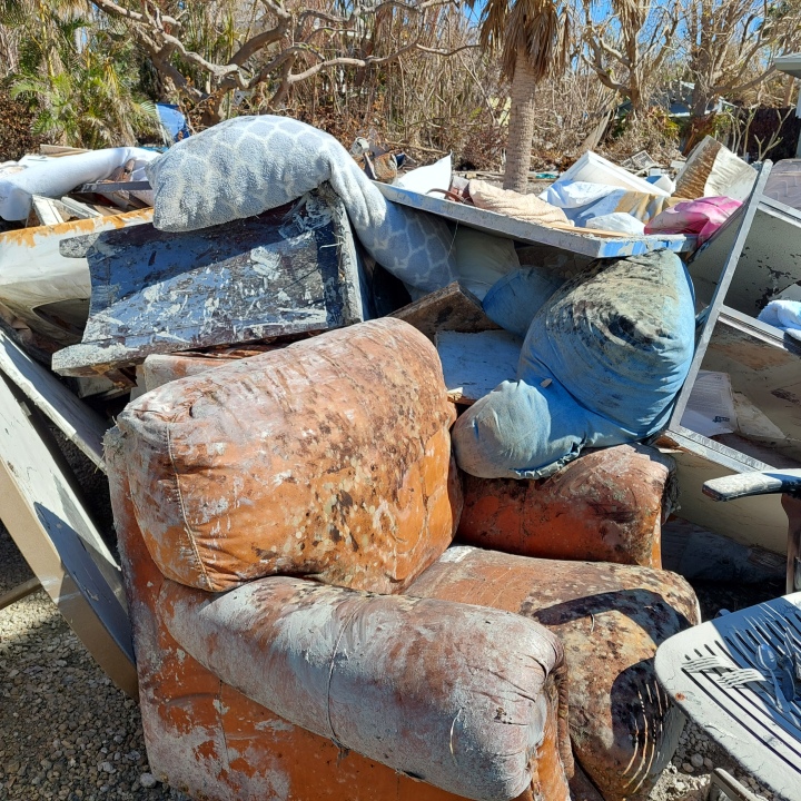Chairs, pillows and other furniture awaiting pickup